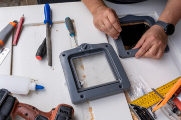 Install cat door to allow cats independent access