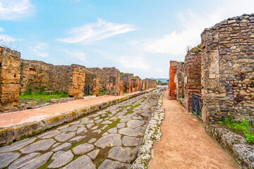 Fototapeta premium Ruins of Pompeii near Naples, Italy. Pompeii is an ancient Roman city. Mount Vesuvius. Panorama of abandoned street in Pompei.