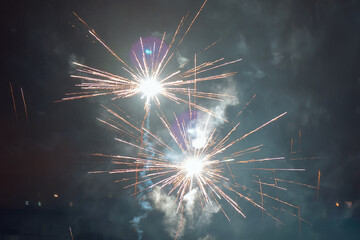 Beautiful colorful fireworks against a dark sky background. Selective focus, background, texture