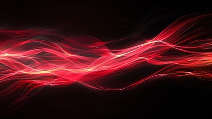Fototapeta premium An abstract design featuring streaks of red light against a black background, creating a dynamic and striking visual effect