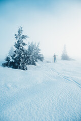 Mountaineer backcountry ski walking ski alpinist in the mountains. Ski touring in alpine landscape...