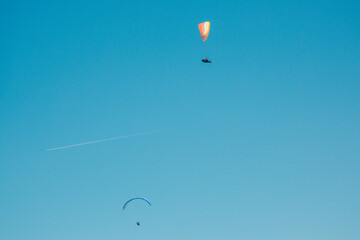 red and yellow Parachute flying above land