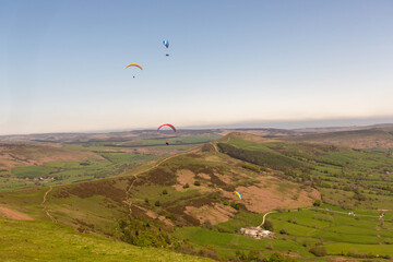 red and yellow Parachute flying above land