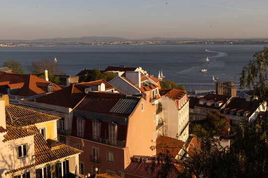View of boats on the Tagus River in Lisbon, Portugal at dusk from Sao Jorge castle.