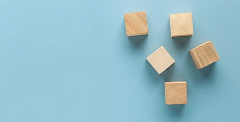 Wooden Blocks on Light Blue Background - Flat Lay, Top View