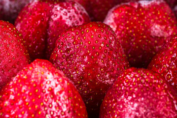 Frozen strawberry close-up view, food background