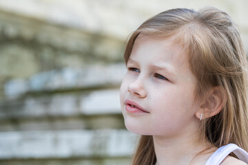 Fototapeta premium Portrait of a little blonde girl, summer outdoor