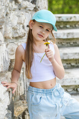 Portrait of a little blonde girl, summer outdoor