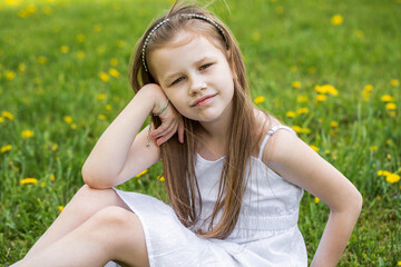 Portrait of a little blonde girl, summer outdoor