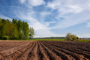 Plowed field in the spring, spring landscape in the countryside