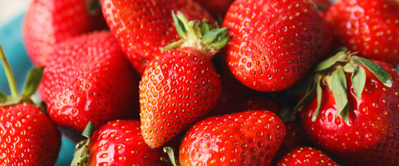 Sweet ripe strawberry on plate, closeup