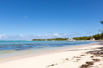 Bavaro beach in sunny day with calm ocean and white  beach, Dominican republic