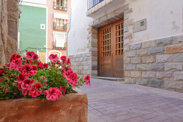 View to beautiful narrow Villajoyosa street with multi-colored houses. La Vila Joiosa - coastal town, Valencian Community, Spain, by Mediterranean sea