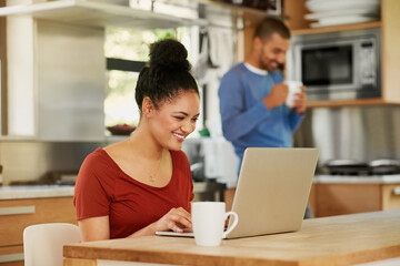 Coffee, laptop and planning with couple in kitchen of home, reading information for online booking. Computer, happy or smile with man and woman in apartment for email, research or social media