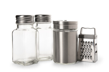 Salt and pepper shakers with grater on white background