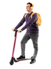 Male student in headphones with modern electric kick scooter on white background