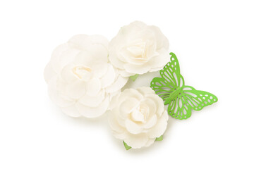 Flowers made of fabric and green plastic butterfly on white background