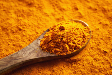 Turmeric root powder on a spoon