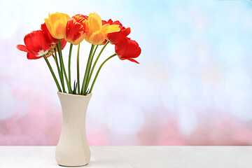 Beautiful spring flowers tulips in a vase on an elegant background, banner. Abstract flower...