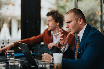 Two stern businessmen engaging in an intense discussion at a cafe, surrounded by coffee and drinks, highlighting serious business interactions.