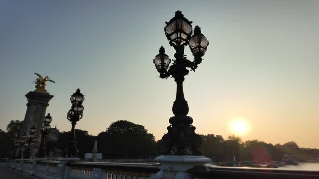 Experience the breathtaking sunrise over Paris, capturing the city's iconic skyline from the Seine. The radiant dawn light highlights the beauty of France's capital.