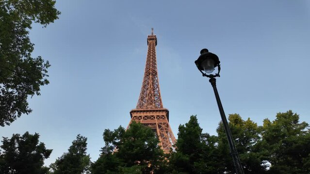 The Eiffel Tower at sunset from various viewpoints and angles. Captures the iconic French architecture, highlighting Paris as the Olympic Games host. Perfect for tourism and event promotions