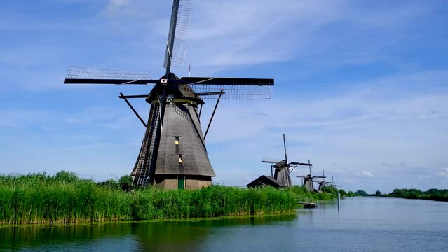 Row of traditional windmills in the village of Kinderdijk, South Holland, Netherlands.