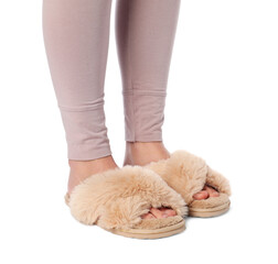 Woman in beige fluffy slippers on white background, closeup