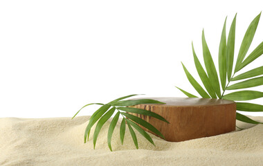 Presentation of product. Wooden podium and palm leaves on sand against white background