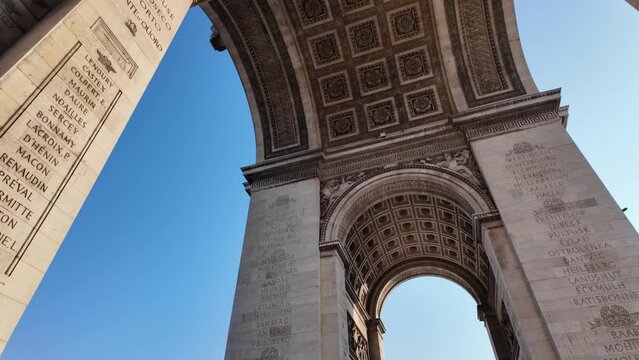 The Arc de Triomphe in Paris, captured from various angles at dawn, highlighting its iconic architecture. Perfect for showcasing Paris, tourism, and the upcoming Olympic Games