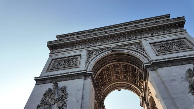 The Arc de Triomphe in Paris, its iconic architecture. Perfect for showcasing Paris, tourism, and the upcoming Olympic Games.