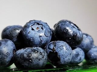 Fresh blueberry background. Drops of water on fresh organic blueberries
