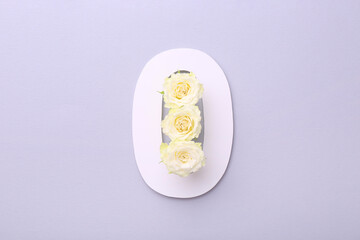 Paper number 0 and beautiful rose flowers on light grey background, top view