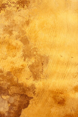 Old run down plastered wall in yellow orange