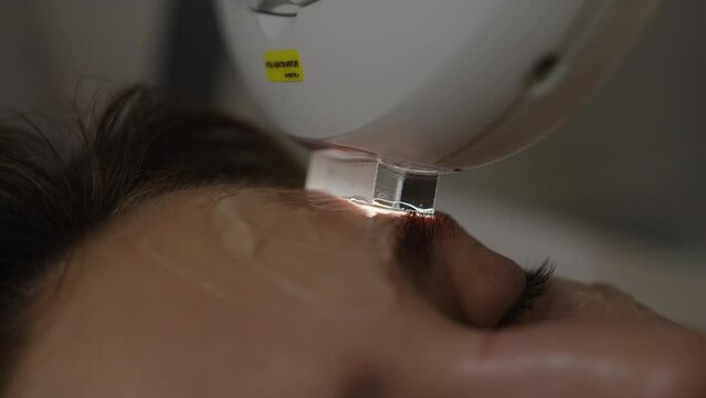 A woman receives IPL therapy in a beauty salon.