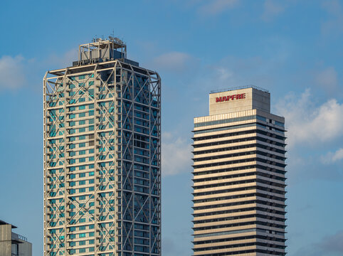 Close up of luxury 5 star Hotel Arts Barcelona and La tour Mapfre, located on the beachfront along the famous Barceloneta Boardwalk, May 2, in Barcelona, ​​Spain