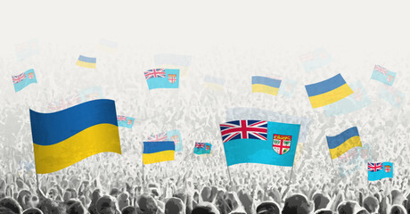 People waving flag of Fiji and Ukraine, symbolizing Fiji solidarity for Ukraine.