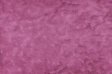 Texture of fluffy pink upholstery fabric or cloth. Fabric texture of artificial fur textile...