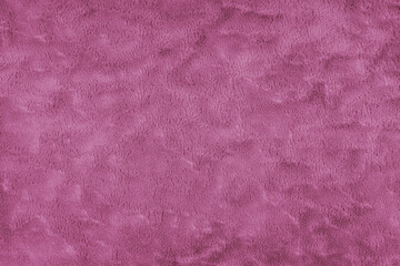 Texture of fluffy pink upholstery fabric or cloth. Fabric texture of artificial fur textile material. Canvas background. Decorative fabric for curtain, furniture, walls, clothes.