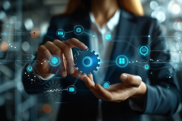 Fototapeta premium Hand touching a digital interface with interconnected gears, symbolizing the intricate and innovative technology involved in modern digital systems and engineering mechanisms