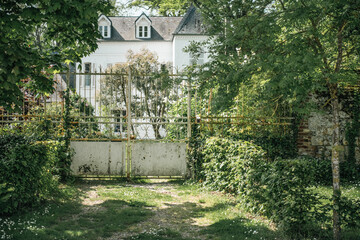 white gate of an old house
