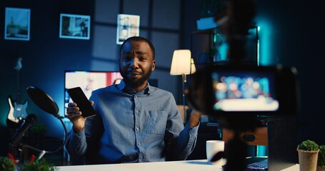 Media star sponsored by tech brand to film review video of their newly released smartphone....