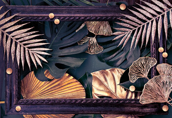 Elegant tropical-themed frame featuring golden leaves and dark green foliage, creating a luxurious,...