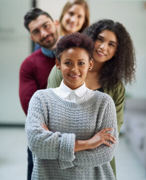 Staff, portrait and confident line in office, teamwork and proud of solidarity or unity in company. Business people, arms crossed and leader of group, support and collaboration in workforce together