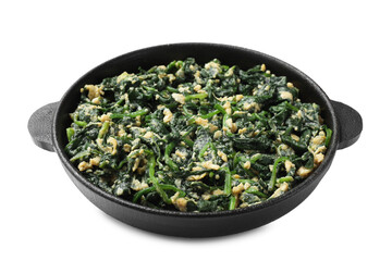Tasty spinach dip with eggs in dish isolated on white