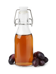 Bottle with wine vinegar and grapes isolated on white