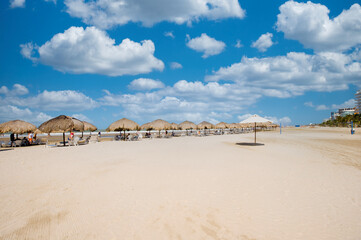 Landscape on La Boquilla beach with beautiful blue sky and sea view.
umbrellas to rest.