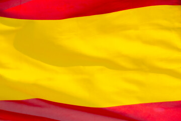 Close-up of the Spanish flag, without the coat of arms, waving in the wind. Spanish flag occupying the whole frame.