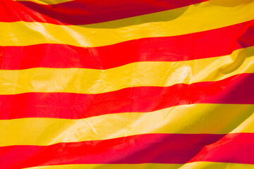 Close-up of the Catalonian flag, waving in the wind. Catalonian flag occupying the whole frame.