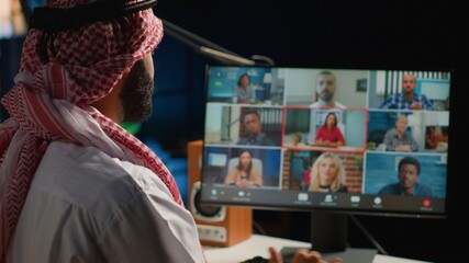 Arab man paying attention in elearning seminar teleconference. Middle Eastern student in online...